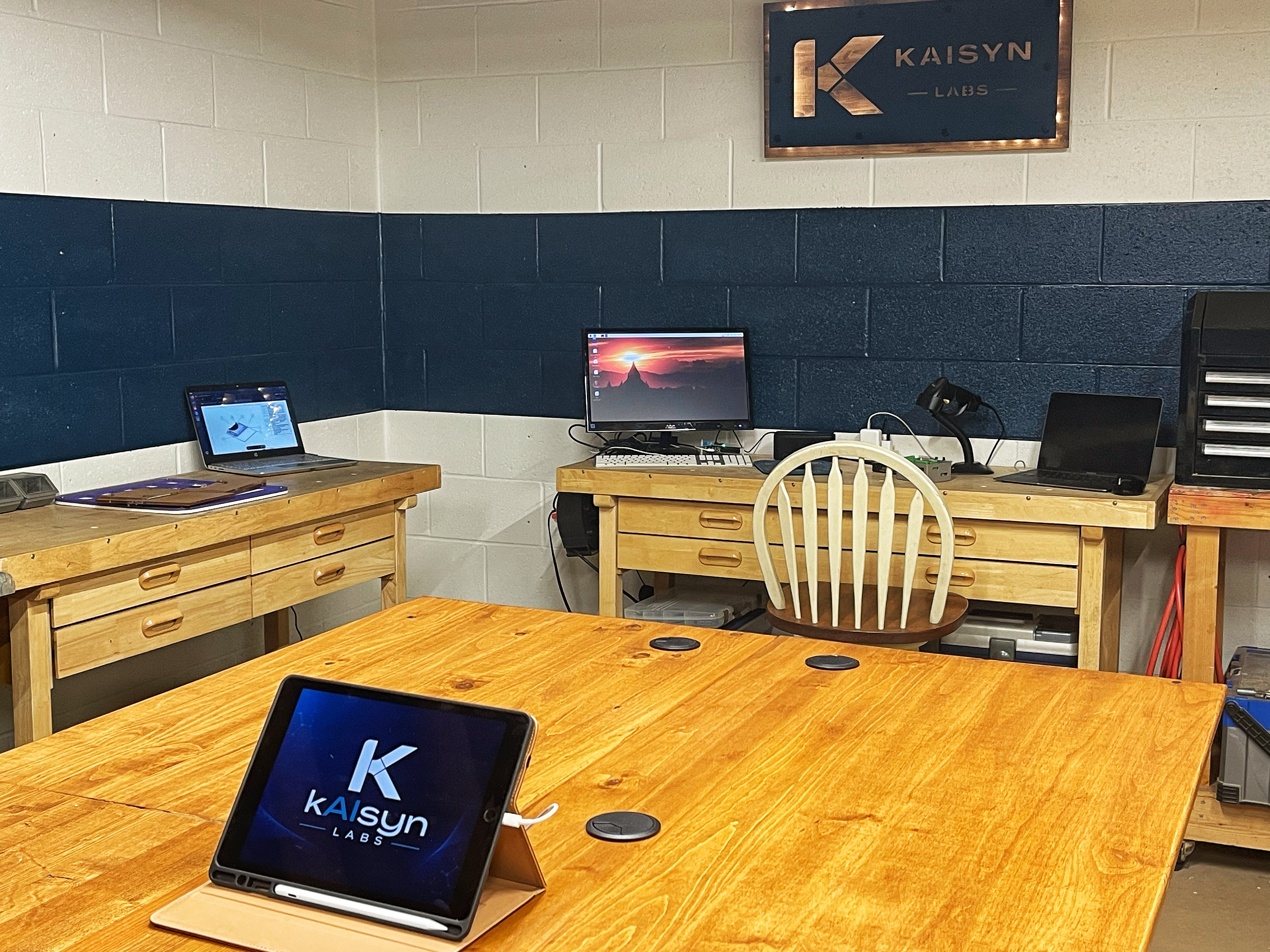 Kaisyn Labs — island table, sign, and all work zones